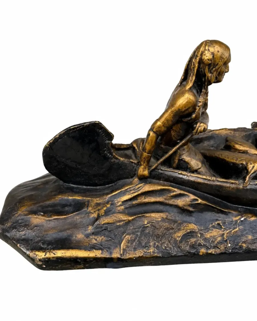 Detail of the paddler on the decorative canoe sculpture