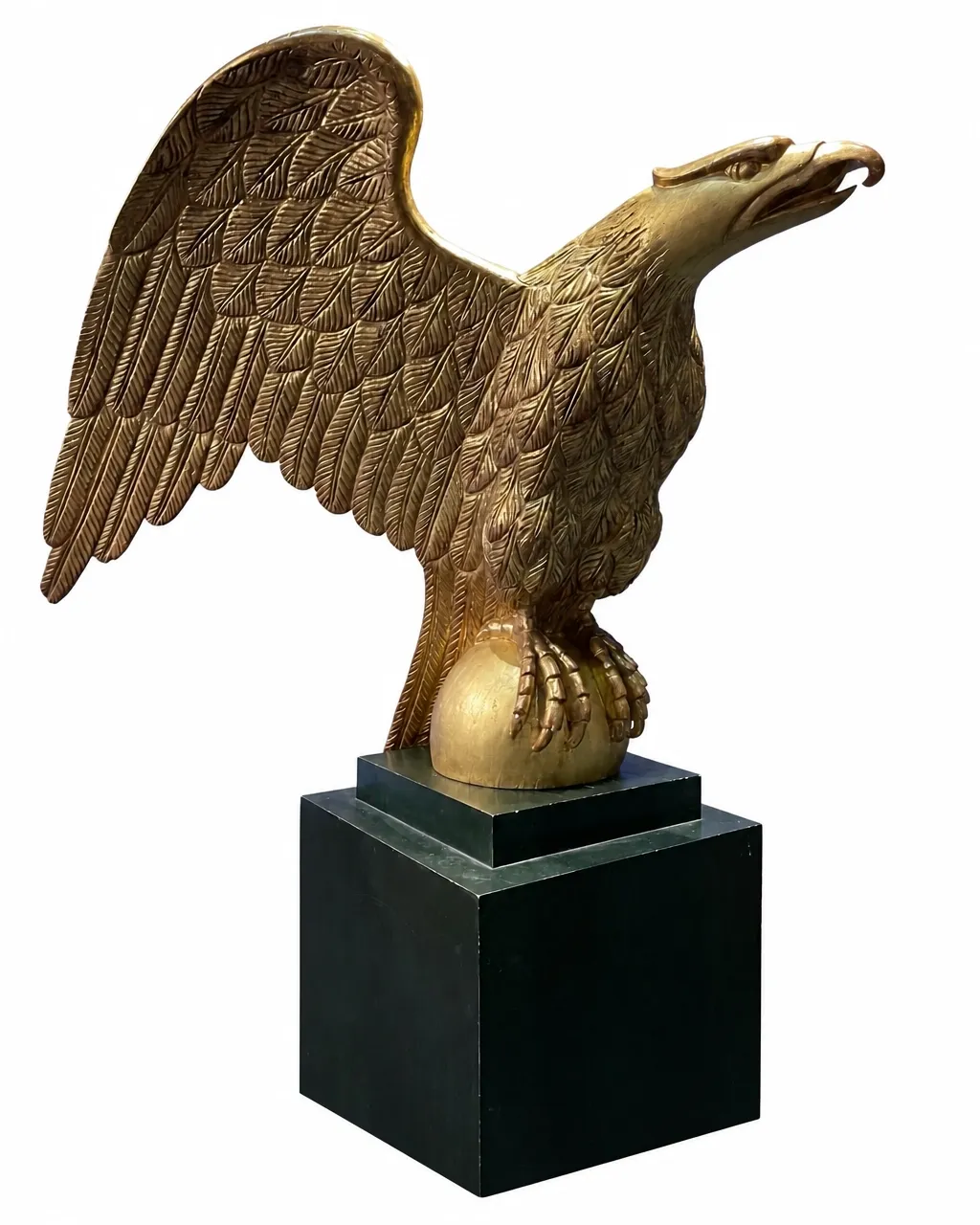 Gilded wooden eagle sculpture isolated on a white background